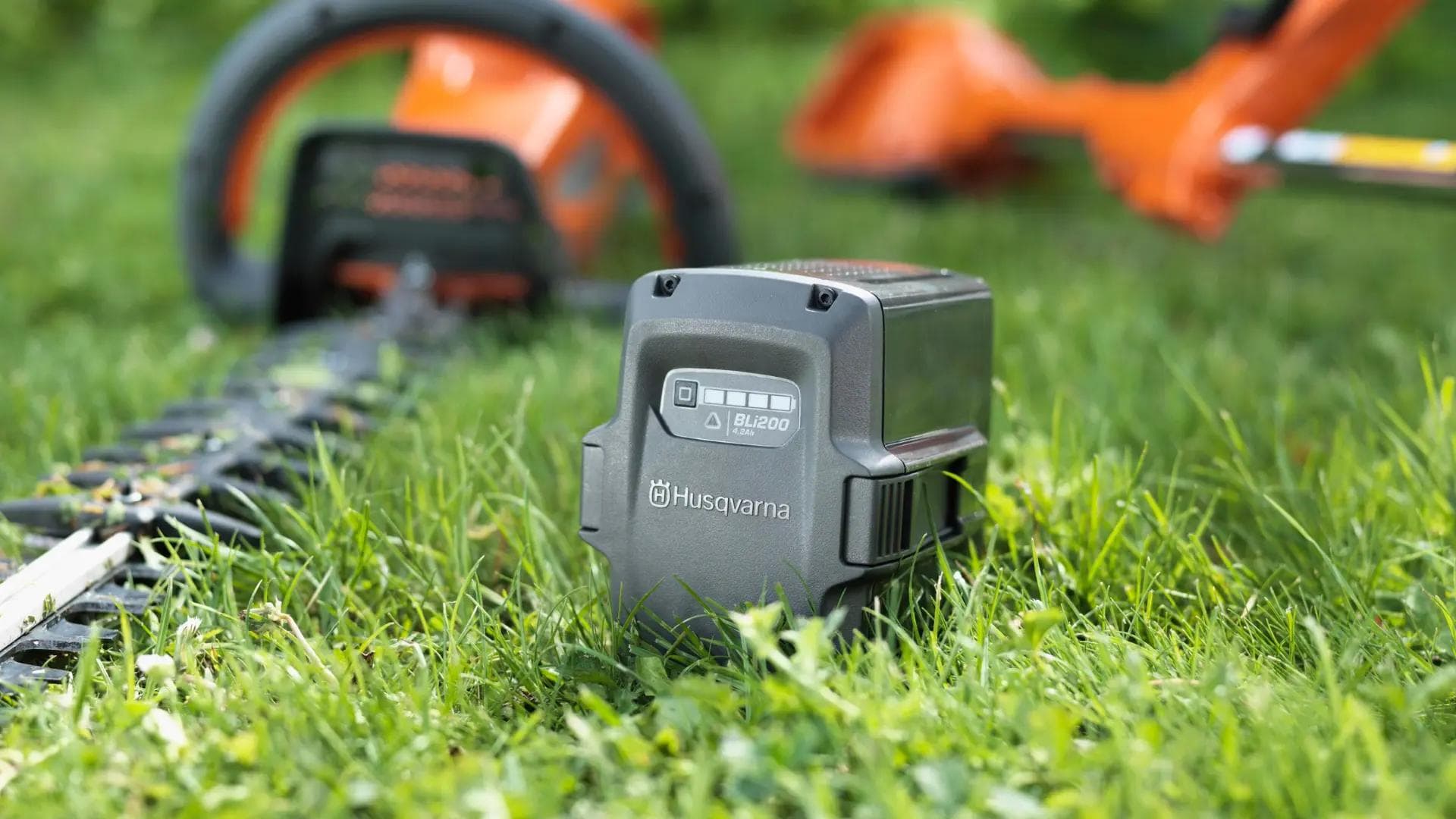 husqvarna battery sitting in grass